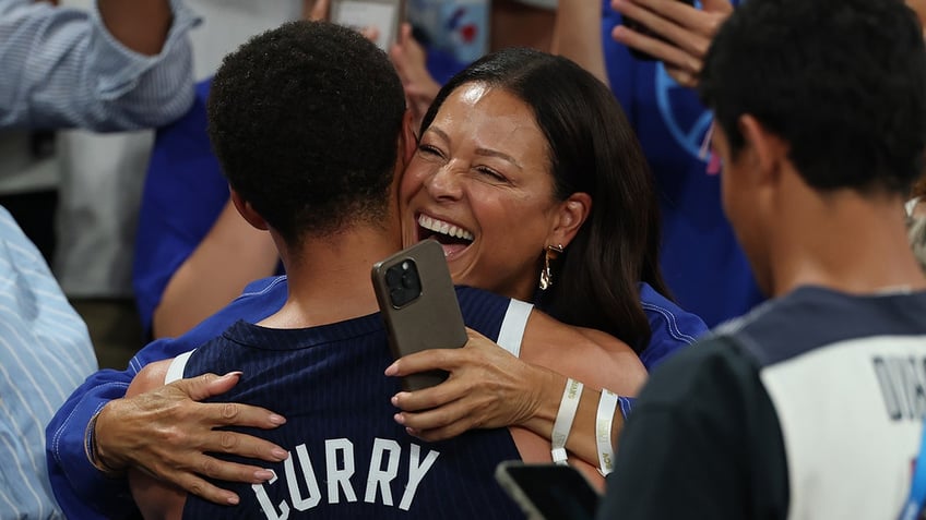 Sonya Curry celebrates with her son