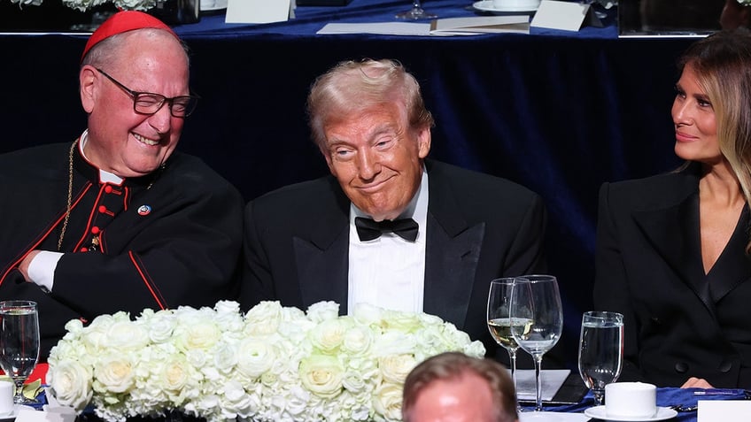 Cardinal Timothy Dolan, Republican presidential nominee, former President Donald Trump and former first lady Melania Trump attend the annual Alfred E. Smith Foundation Dinner