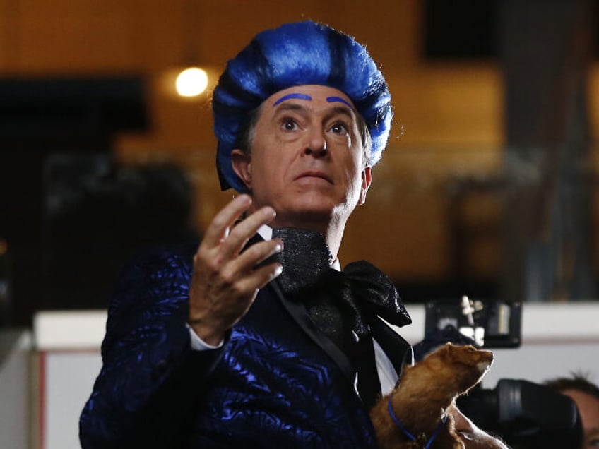 Television personality Stephen Colbert performs on the floor of the Wells Fargo Center ahe