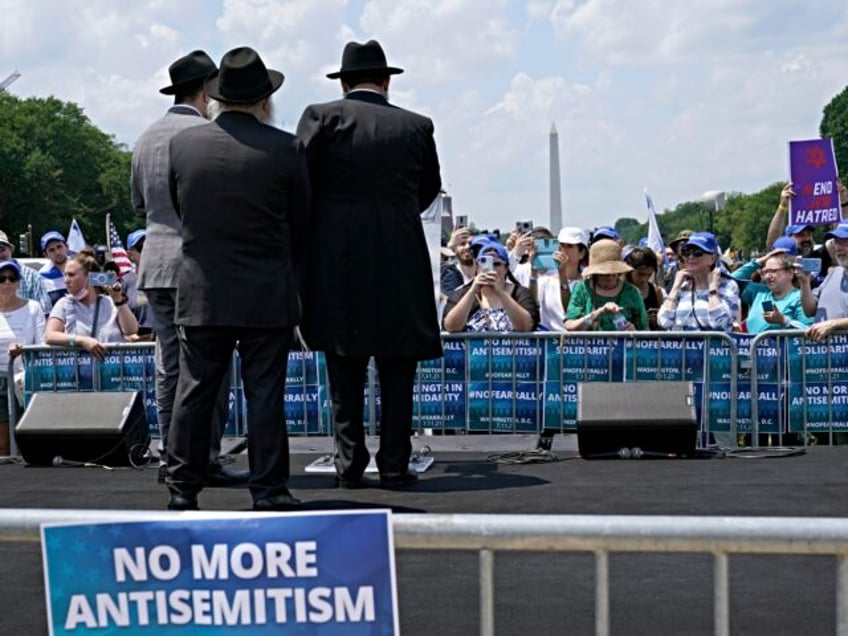 FILE - People attend the "NO FEAR: Rally in Solidarity with the Jewish People" event in Wa