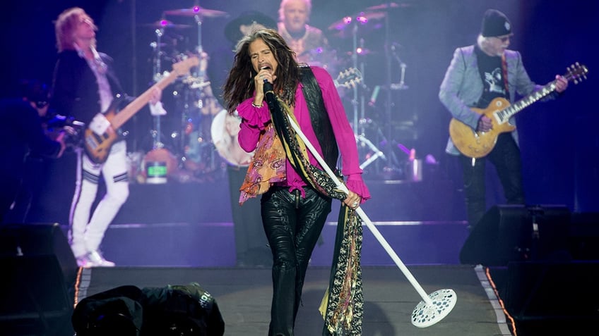 steven tyler postpones aerosmith shows frontman faces years of injury rehab and sexual assault accusations