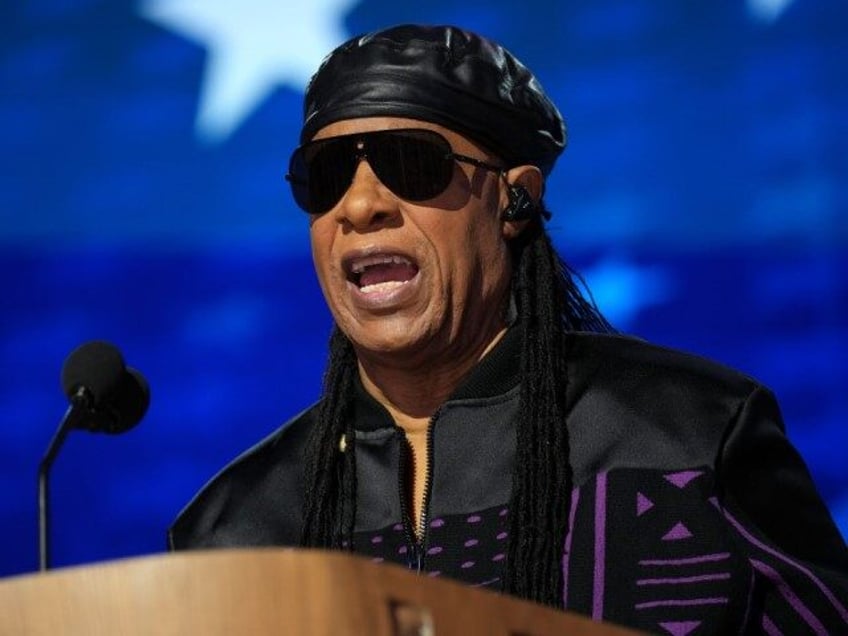 Musician Stevie Wonder speaks on stage during the third day of the Democratic National Con