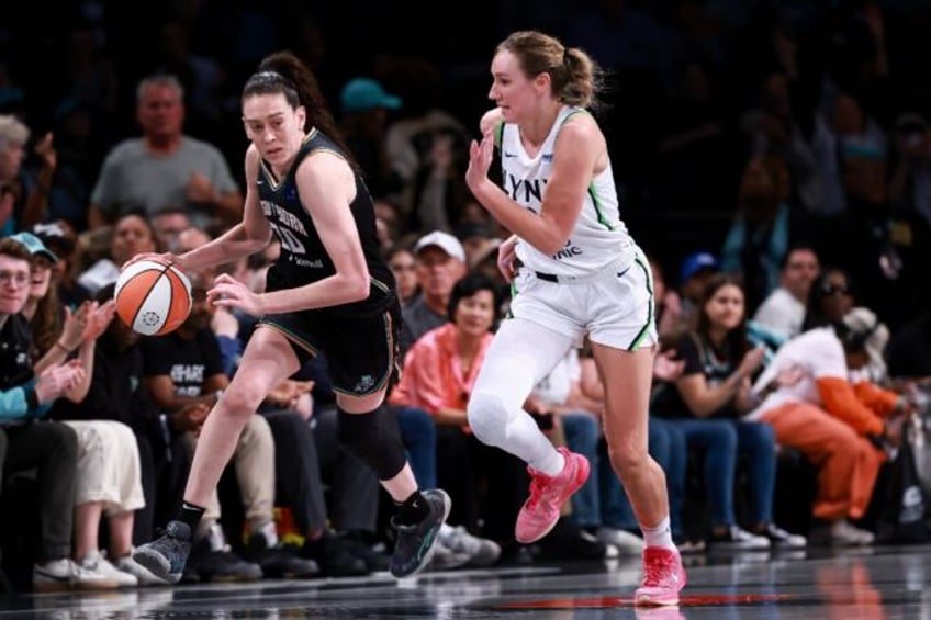 New York Liberty forward Breanna Stewart drives past Alanna Smith of the Minnesota Lynx in