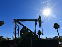 Stocks retreat, oil slides further on US economy worries