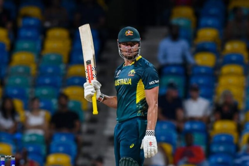 Australia's Marcus Stoinis marks his half-century in a swashbuckling 66 not out against Om