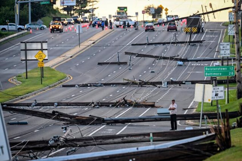 storm damaged eastern us communities clear downed trees and race to restore power