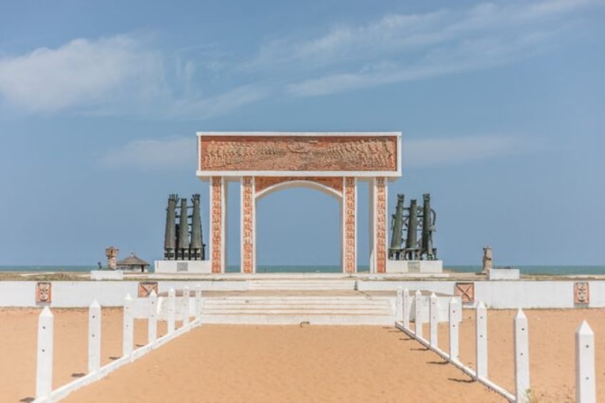 Ouidah is scattered with memorials to the slave trade like the "The door of no return" whe