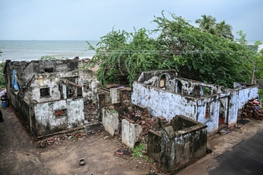 Houses destroyed by the 2004 tsunami still lie abandoned in Akkaraipettai village in India