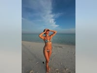 'Stranger Things' star Millie Bobby Brown sizzles in tiny string bikini during beach getaway