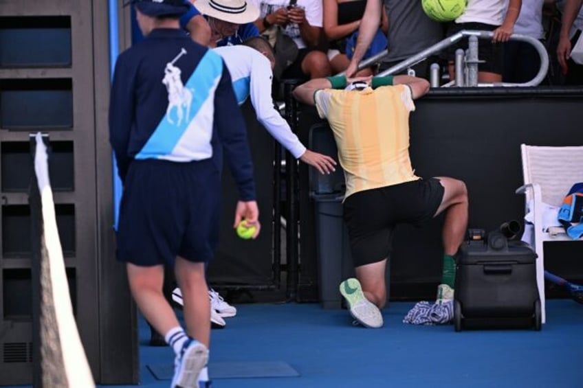 Britain's Jack Draper vomits after winning his Australian Open first round match