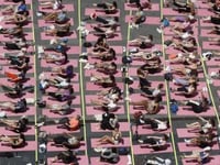 Stretching into summer: Yoga workouts mark solstice in longest day