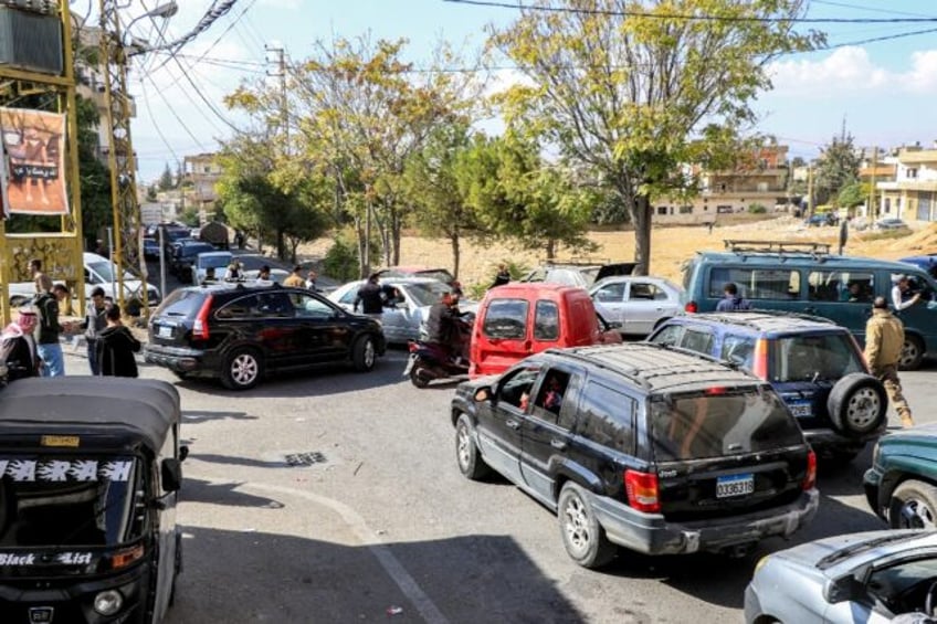 Traffic snarls the roads out of Baalbek as residents flee Lebanon's main eastern city foll