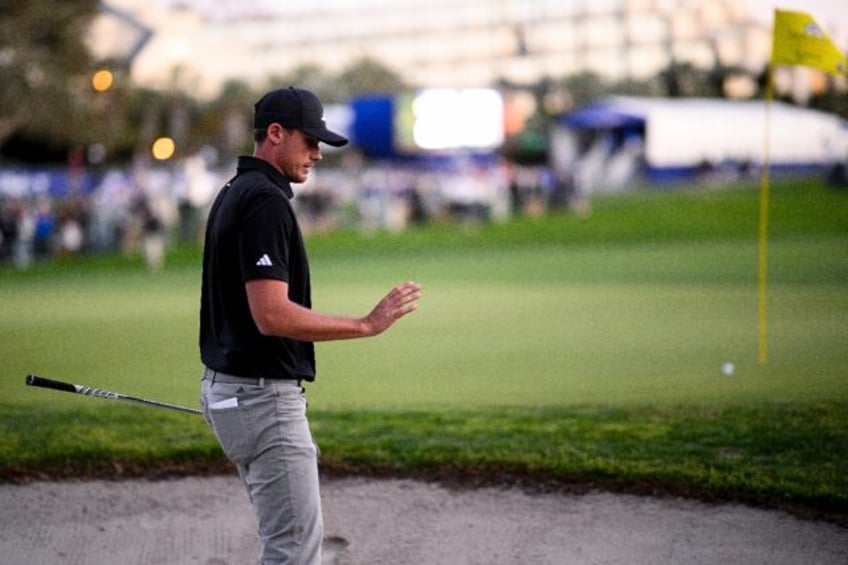 Ludvig Aberg battled through wind to hold a share of the lead at the Farmers Insurance Ope