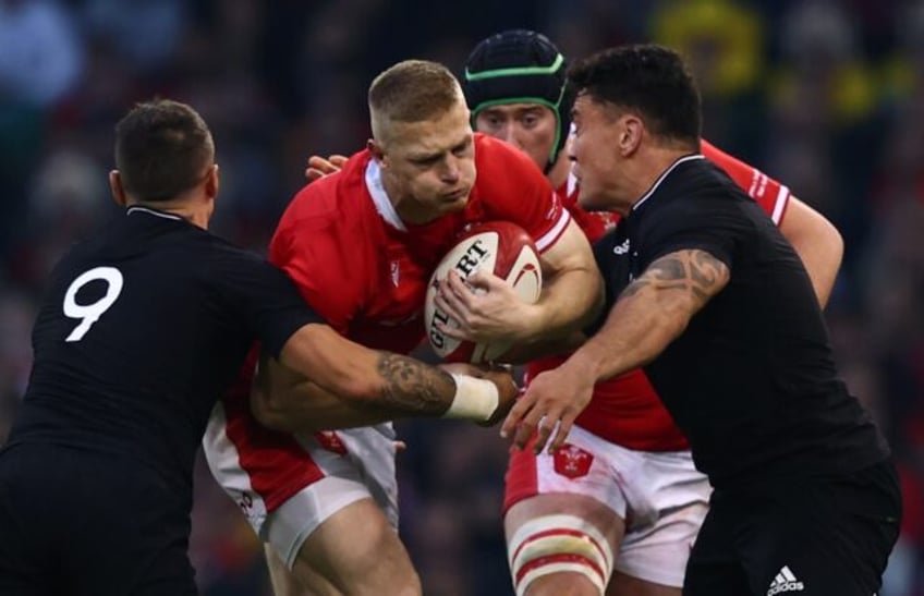 Wales' full-back Johnny McNicholl (C) has signed for the Canterbury Crusaders for the rest