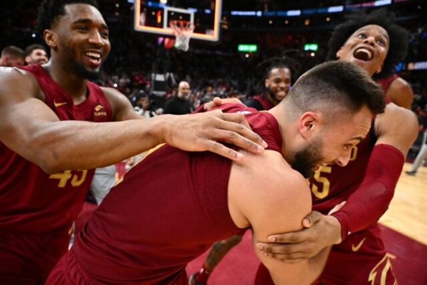 Cleveland's Max Strus is mobbed by team-mates after his monster buzzer-beater in the Caval