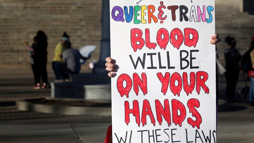 students march against university removing tampons from mens bathrooms