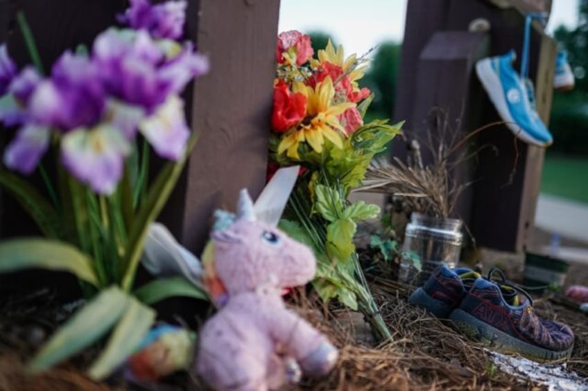 Along the edge of Lake Herrick in Athens, Georgia is a makeshift memorial to Laken Riley,