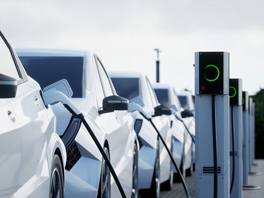 Generic electric car charging on a city street