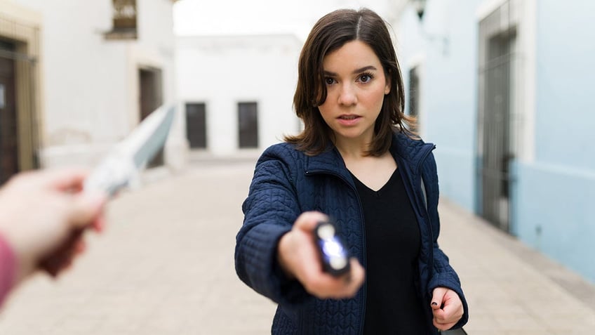 woman using a taser