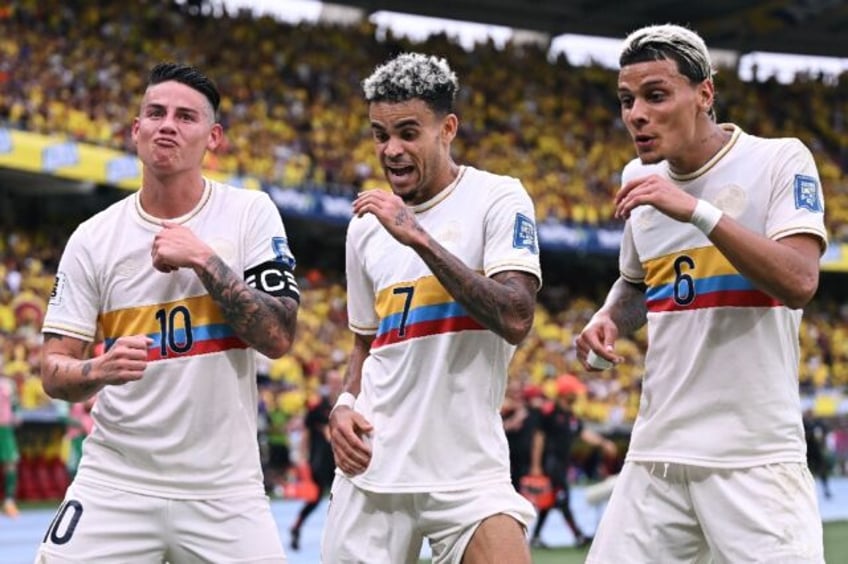 Colombia's forward Luis Diaz (7) celebrates with team-mates James Rodriguez (10) and Richa