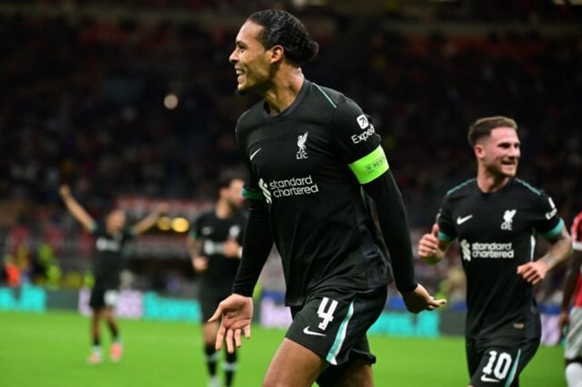 Virgil van Dijk celebrates scoring Liverpool's second against AC Milan