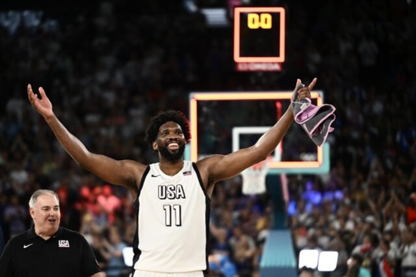 Joel Embiid of the United States celebrates the team's Olympic mens' basketball semi-final