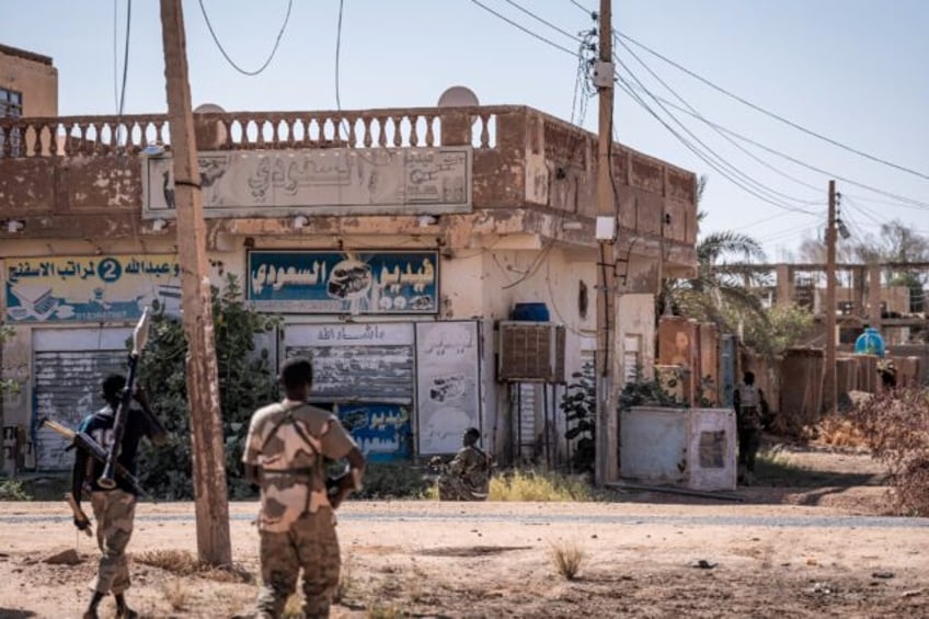 Sudanese army soldiers patrol an area in Khartoum North on November 3, 2024