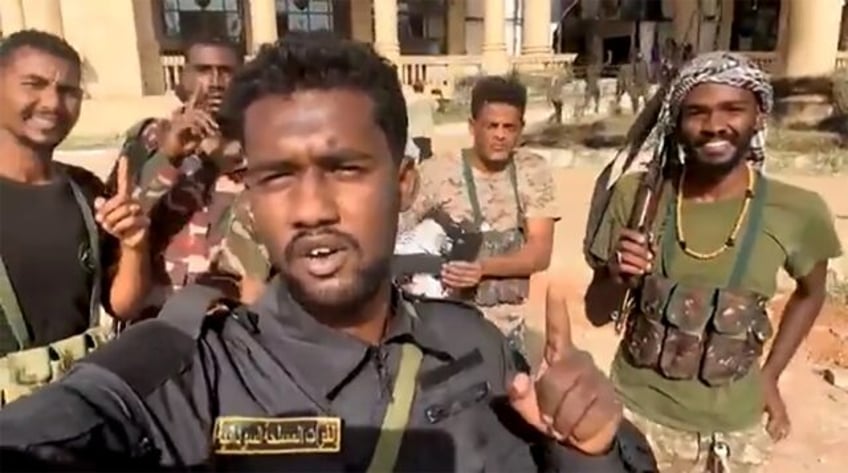 This image grab from social media video shows Sudanese volunteers celebrating the regular