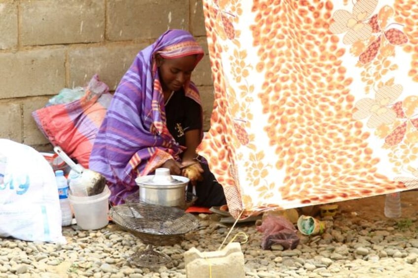 Sudanese civilians, already displaced by conflict, were evacuated to a makeshift campsite