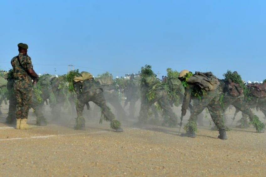 Newly graduated Sudanese soldiers at a ceremony before being sent into battle in the count