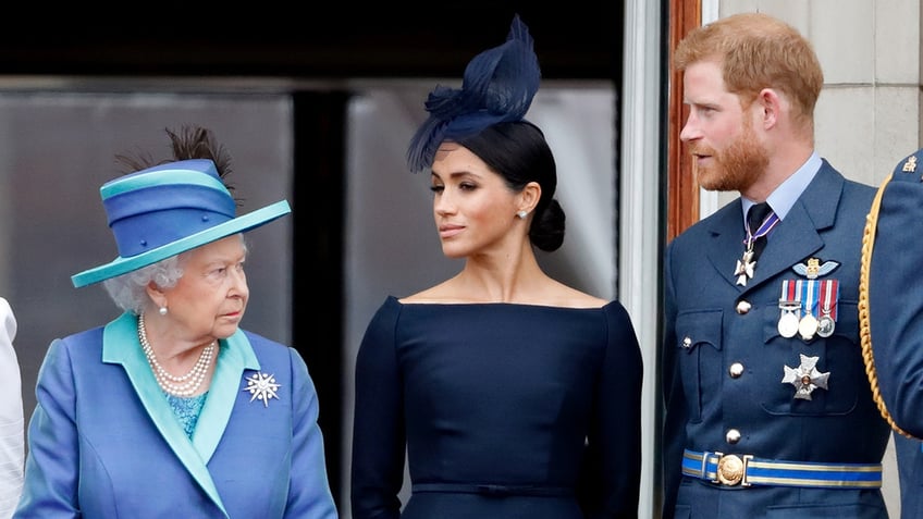 Queen Elizabeth looking sternly at Meghan Markle and Prince Harry