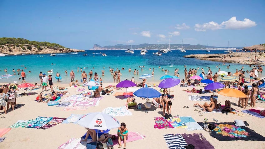 People Enjoy the Beach in Ibiza