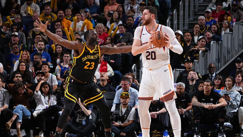 Draymond Green guards Jusuf Nurkic