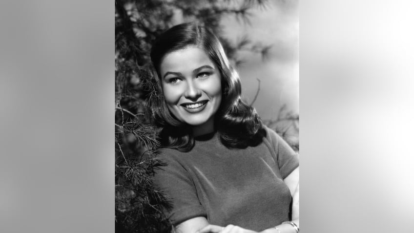 Nancy Olson Livingston smiling for a glamour shot