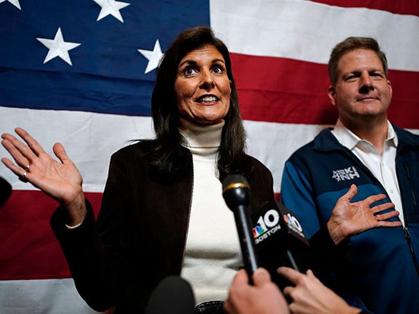 Republican presidential candidate former U.N. Ambassador Nikki Haley and Gov. Chris Sununu speaks to reporters following a town hall campaign event, Tuesday, Dec. 12, 2023, in Manchester, N.H. Haley received the New Hampshire governor's endorsement. (AP Photo/Robert F. Bukaty)