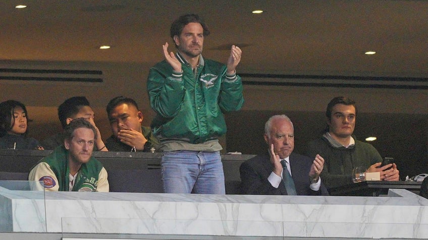 Bradley Cooper cheering on the Philadelphia Eagles at a game.