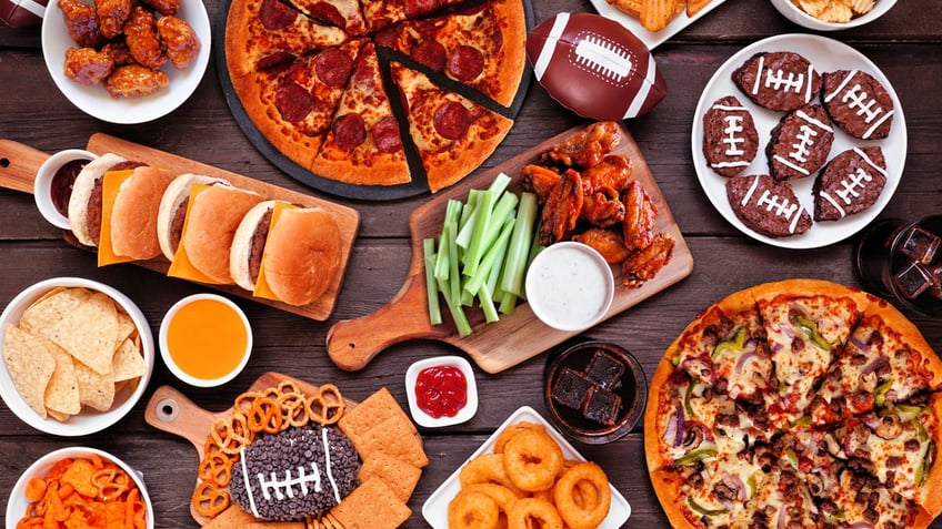 A spread of various Super Bowl foods is shown from above.