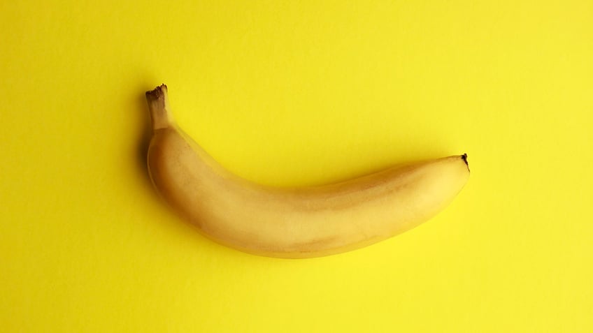 Photo of a banana on a yellow background