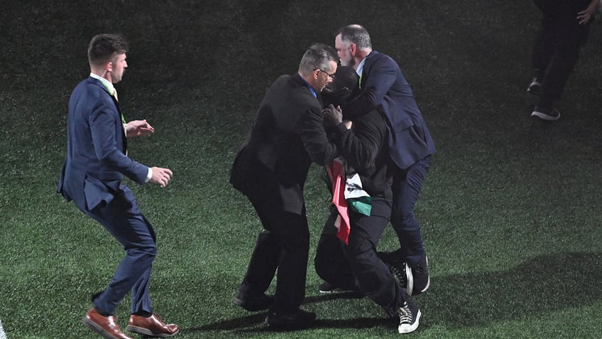 Protester during halftime