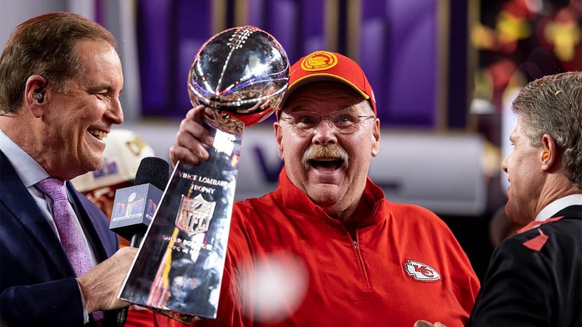 Andy Reid hoists the Lombardi Trophy