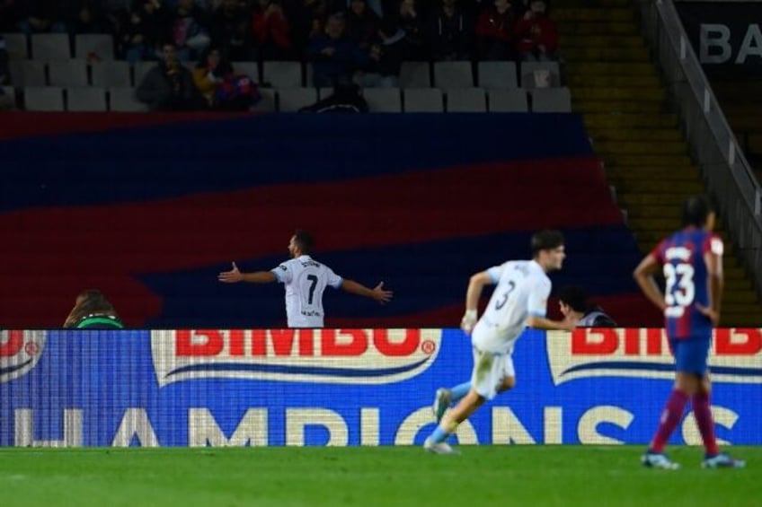 Girona's Uruguayan forward Cristhian Stuani celebrates after scoring his team's fourth goal in the historic win over Barcelona