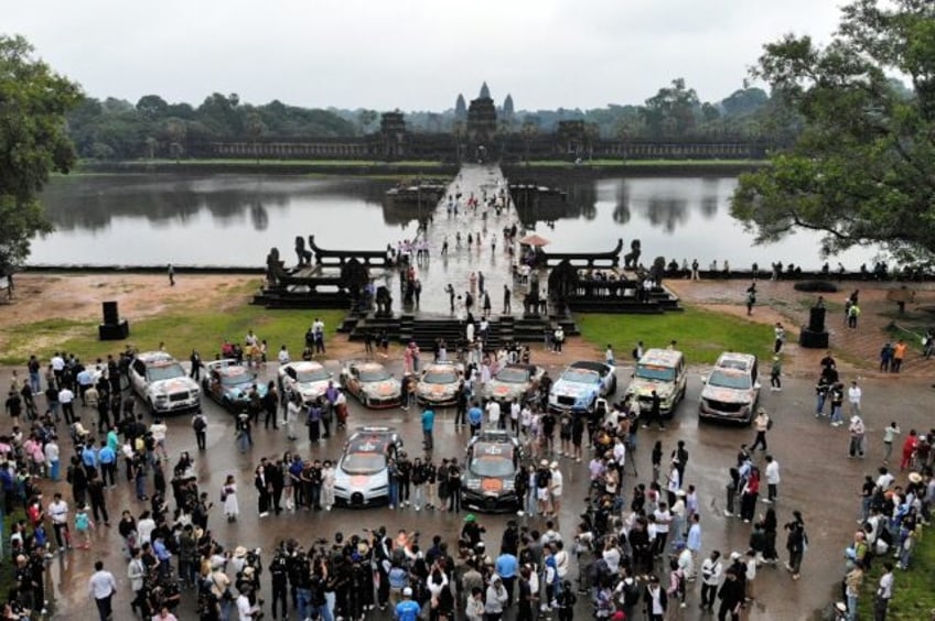 A parade of expensive supercars gathered at Cambodia's famed Angkor Wat temple complex, al