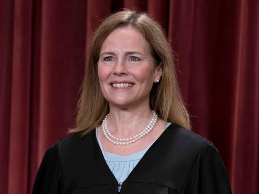 Associate Justice Amy Coney Barrett joins other members of the Supreme Court as they pose