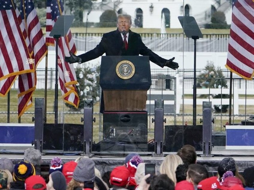 With the White House in the background, President Donald Trump speaks at a rally in Washin