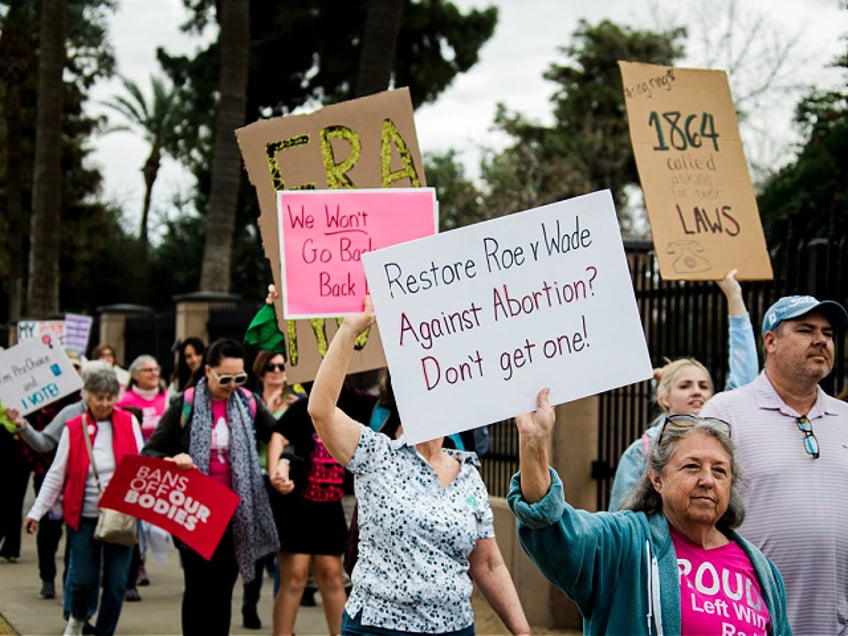 Demonstrators during a Women's March rally in Phoenix, Arizona, US, on Saturday, Jan. 20, 2024. The annual march is taking place ahead of the anniversary of the US Supreme Court's Roe v. Wade ruling enshrining a women's right to abortion, which was overturned in 2022. Photographer: Caitlin O'Hara/Bloomberg via Getty Images