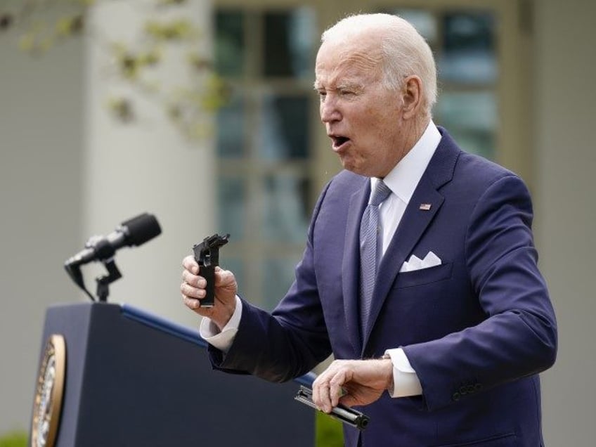 Hunter - President Joe Biden holds pieces of a 9mm pistol as he speaks in the Rose Garden