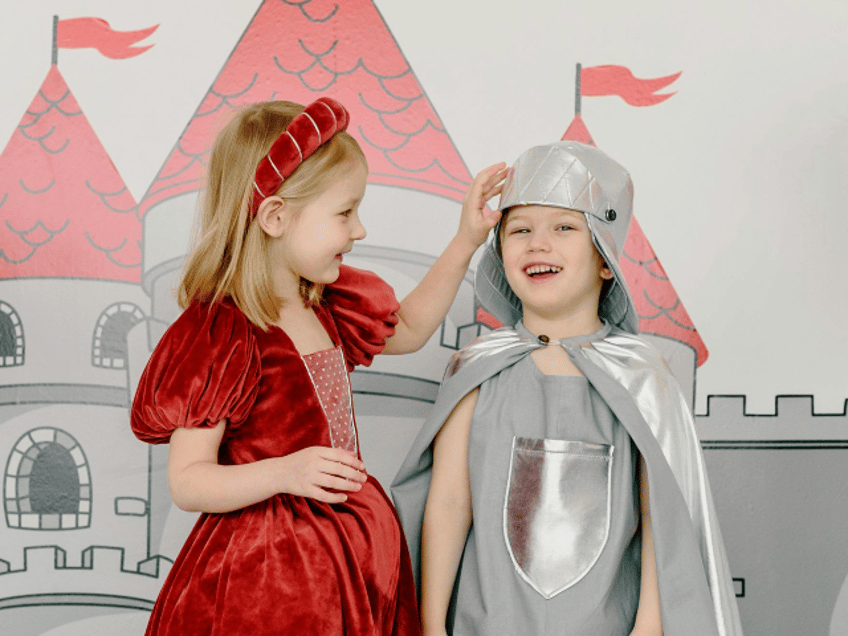 Children in Costumes Standing Beside a Castle Wall Painting
