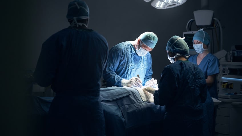 Surgeons operating