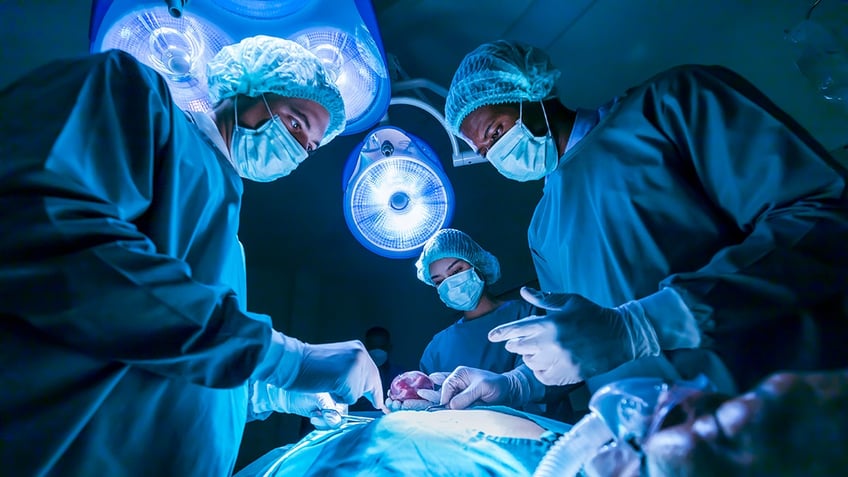 surgery team over patient