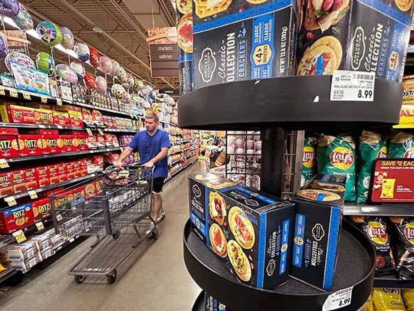 A customer shops at a grocery store in Chicago, Sept. 19, 2024. (AP Photo/Nam Y. Huh, File